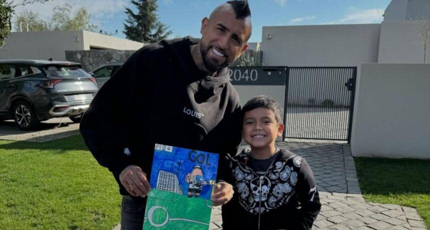 Dad's pride: Arturo Vidal shows off the stunning goal scored by his youngest son