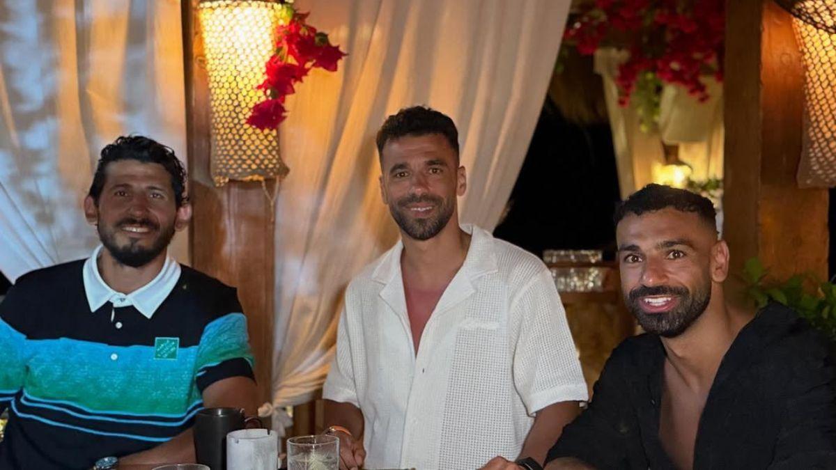 In great company: Salah shares vacation snapshots with friends during his holiday