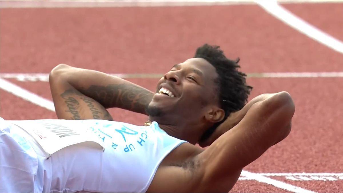 Track athlete Chris Robinson wins 400m hurdles despite wardrobe malfunction