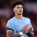 Nico O'Reilly of Manchester City claps the fans after the Premier League match