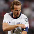 Harry Kane of England adjusts his captain's armband during the FIFA World Cup 2026