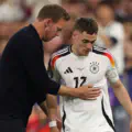 Florian Wirtz of Germany is embraced by Julian Nagelsmann, Head Coach of Germany