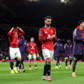 Bruno Fernandes of Manchester United acknowledges the fans as he leaves the pitch with team mates following defeat in the Premier League match between Manchester United and Everton