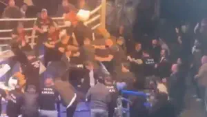 Hit with chairs and kicked. Boxer attacked immediately after victory