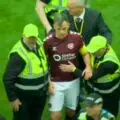 Scandal erupts after Celtic's championship win. Hearts captain attacked by fans right on the pitch