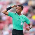Omar Abdulkadir Artan reacts after being turned away on arrival in the United States for the World Cup 