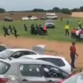 Madness on a football pitch in Africa. Enraged fan drove onto the field to run over the referee. VIDEO