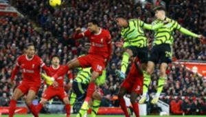 Arsenal maintained their leadership position after securing a draw at Anfield